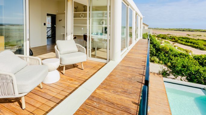 Workspace with desk and lagoon view at MBIZI lagoon house