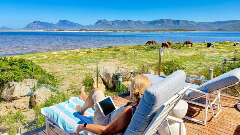 Open living space connected to terrace and outdoor area at MBIZI lagoon house
