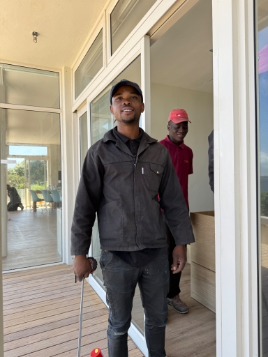 Two craftsmen who worked on the renovation of MBIZI lagoon house in Fisherhaven, Hermanus