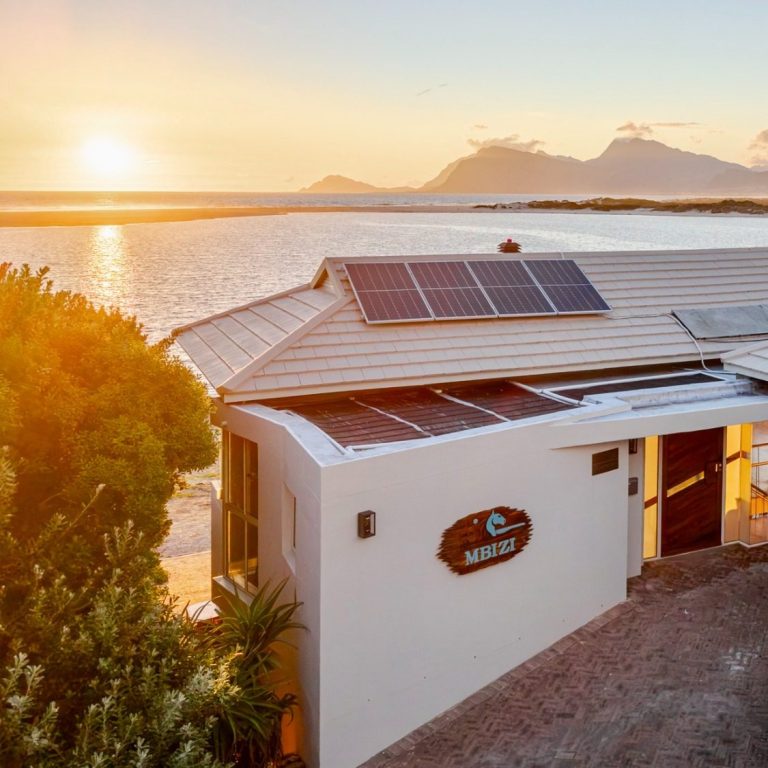 Evenings by the lagoon, slow and quiet Golden sunset over Bot River Lagoon viewed from the terrace of MBIZI lagoon house near Hermanus