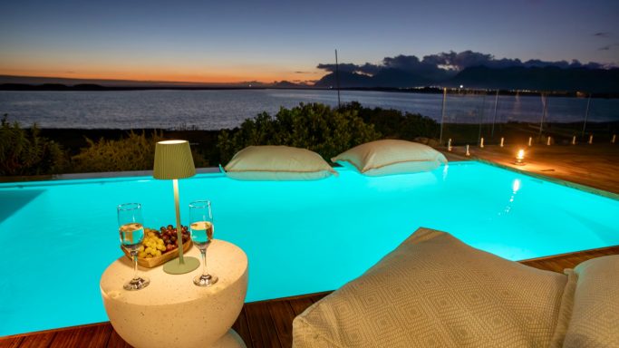 Swimming pool with lagoon and ocean views at MBIZI lagoon house