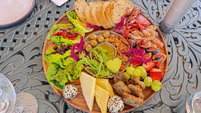 Outdoor wine and food pairing at a scenic Overberg wine estate near Hermanus, South Africa