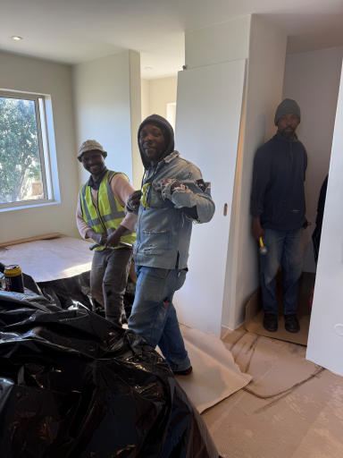 Construction crew working on the interior renovation of MBIZI lagoon house, Hermanus, South Africa